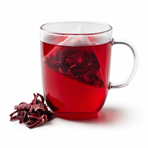 A glass mug of ruby-red hibiscus tea with a pyramid tea bag